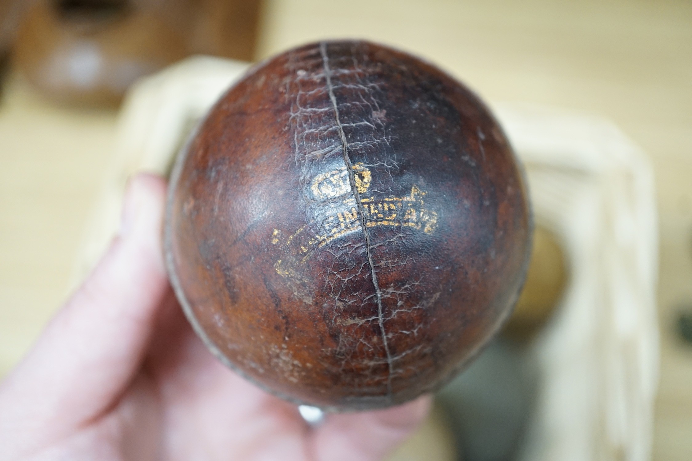 A collection of leather cricket and sporting balls